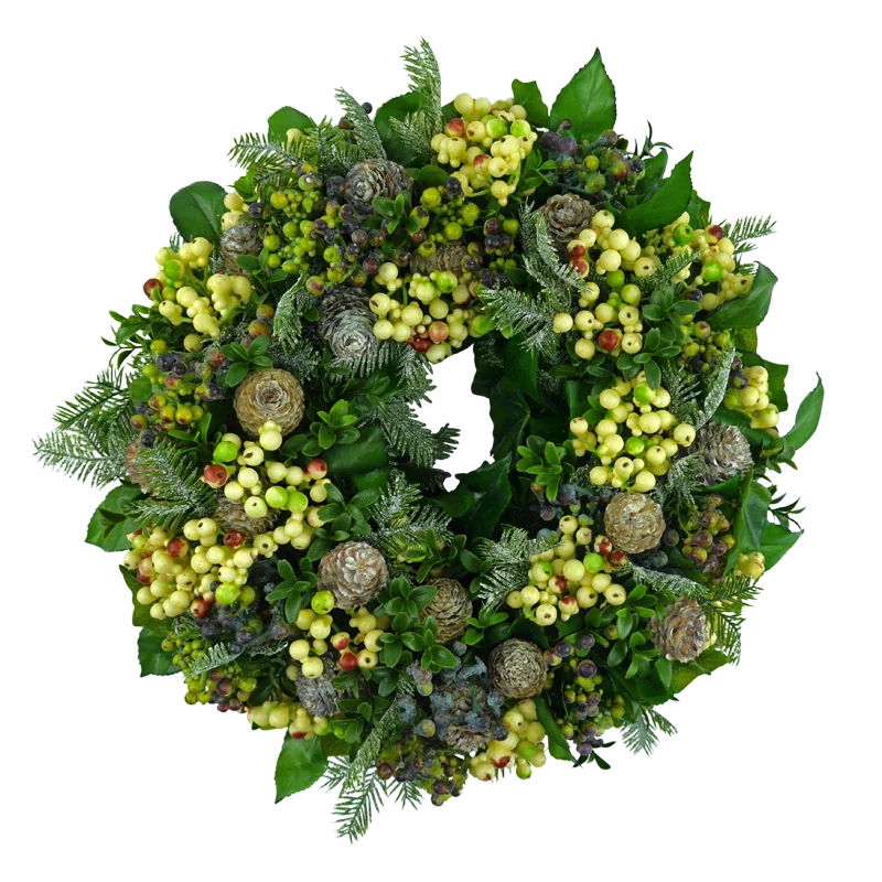 Winter wreath with berries, cones and iced fir