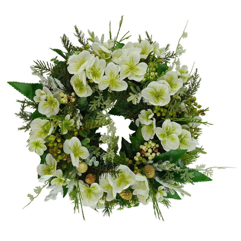 Winter wreath with Christmas rose berries and cones